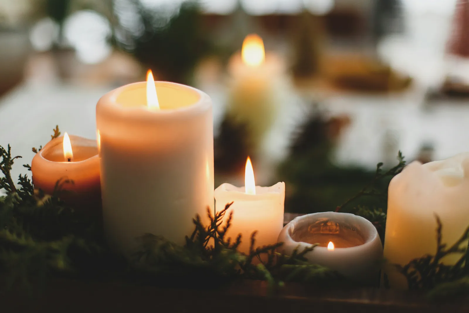 Warm candles glowing at home on Christmas Day